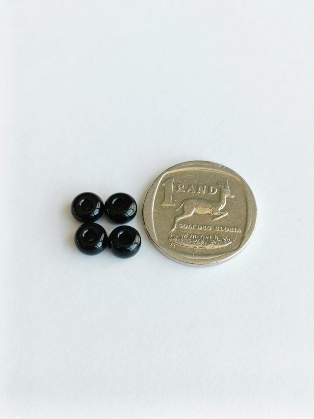 Loose Black Seed Glass Beads, Four Beads with coin, front shot